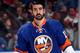 UNIONDALE, NY - DECEMBER 28: Cal Clutterbuck #15 of the New York Islanders looks on prior to a game against the New Jersey Devils at the Nassau Veterans Memorial Coliseum on December 28, 2013 in Uniondale, New York. (Photo by Alex Trautwig/Getty Images)