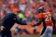 DENVER, CO - OCTOBER 13: Head coach John Fox of the Denver Broncos celebrates with running back Knowshon Moreno #27 after he scored a third quarter touchdown against the Jacksonville Jaguars at Sports Authority Field Field at Mile High on October 13, 201