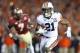 Jan 6, 2014; Pasadena, CA, USA; Auburn Tigers running back Tre Mason (21) carries the ball past Florida State Seminoles linebacker Christian Jones (7) during the first half of the 2014 BCS National Championship game at the Rose Bowl. Mandatory Credit: Ma
