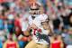 CHARLOTTE, NC - JANUARY 12: Colin Kaepernick #7 of the San Francisco 49ers looks to pass in the first quarter against the Carolina Panthers during the NFC Divisional Playoff Game at Bank of America Stadium on January 12, 2014 in Charlotte, North Carolina.