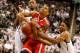 EAST LANSING, MI - JANUARY 07: Marc Loving #2 of the Ohio State Buckeyes gets the ball stripped by Gary Harris #14 of the Michigan State Spartans during overtime at the Jack T. Breslin Student Events Center on January 7, 2014 in East Lansing, Michigan. M