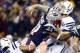 Jan 11, 2014; Foxborough, MA, USA; Indianapolis Colts quarterback Andrew Luck (12) is hit by New England Patriots outside linebacker Jamie Collins (91) in the first half during the 2013 AFC divisional playoff football game at Gillette Stadium. Mandatory C