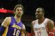 HOUSTON, TX - NOVEMBER 07: Dwight Howard #12 of the Houston Rockets (R) waits on the court with Pau Gasol #16 of the Los Angeles Lakers during the game at Toyota Center on November 7, 2013 in Houston, Texas. NOTE TO USER: User expressly acknowledges and