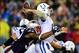 Jan 11, 2014; Foxborough, MA, USA; Indianapolis Colts quarterback Andrew Luck (12) throws a pass while being hit by New England Patriots outside linebacker Jamie Collins (91) during the third quarter of the 2013 AFC divisional playoff football game at Gi