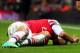 LONDON, ENGLAND - JANUARY 04: (EDITORS NOTE: Retransmission of image #460558025 with an alternate crop) Theo Walcott of Arsenal lies injured on the pitch during the Budweiser FA Cup third round match between Arsenal and Tottenham Hotspur at Emirates Sta