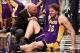 Feb. 5, 2013; Brooklyn, NY, USA; Los Angeles Lakers power forward Pau Gasol (16) is checked by the trainer after an apparent injury on the court against the Brooklyn Nets during the second half at Barclays Center. Lakers won 92-83. Mandatory Credit: Debby
