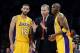 Jan 14, 2014; Los Angeles, CA, USA; Los Angeles Lakers head coach Mike D'Antoni talks to point guard Kendall Marshall (12) and shooting guard Jodie Meeks (20) in the second half of the game against the Cleveland Cavaliers at Staples Center. Cleveland Cava