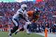 DENVER, CO - JANUARY 12: Wes Welker #83 of the Denver Broncos scores a second quarter touchdown against the defense of Darrell Stuckey #25 of the San Diego Chargers during the AFC Divisional Playoff Game at Sports Authority Field at Mile High on Januar