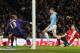 MANCHESTER, ENGLAND - JANUARY 15: Edin Dzeko of Manchester City scores his team's fifth goal during the Budweiser FA Cup Third Round Replay match between Manchester City and Blackburn Rovers at the Etihad Stadium on January 15, 2014 in Manchester, Englan