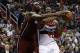 Jan 15, 2014; Washington, DC, USA; Washington Wizards power forward Nene Hilario (42) is fouled by Miami Heat center Chris Bosh (1) in the second quarter at Verizon Center. Mandatory Credit: Geoff Burke-USA TODAY Sports