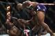 Jan 15, 2014; Duluth, GA, USA; Yoel Romero ( red gloves) fights Derek Brunson during UFC Fight Night at Gwinnett Center. Romero wons. Mandatory Credit: Joshua S. Kelly-USA TODAY Sports