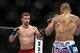 Jan 15, 2014; Duluth, GA, USA; John Moraga (red gloves) fights Dustin Ortiz (blue gloves) during UFC Fight Night at Gwinnett Center. Mandatory Credit: Joshua S. Kelly-USA TODAY Sports
