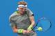 MELBOURNE, AUSTRALIA - JANUARY 15: Denis Istomin of Uzbekistan plays a backhand in his second round match against Dmitry Tursunov of Russia during day three of the 2014 Australian Open at Melbourne Park on January 15, 2014 in Melbourne, Australia. (Phot