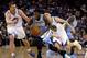 OAKLAND, CA - JANUARY 15: Nate Robinson #10 of the Denver Nuggets dribbles past David Lee #10 and Klay Thompson #11 of the Golden State Warriors at ORACLE Arena on January 15, 2014 in Oakland, California. NOTE TO USER: User expressly acknowledges and agr