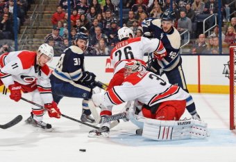 COLUMBUS, OH - JANUARY 10: Goaltender Anton Khudobin #31 of the Carolina Hurricanes watches a loose puck as he defends the net during the third period in a game against the Columbus Blue Jackets on January 10, 2014 at Nationwide Arena in Columbus, Ohio. C