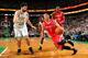 BOSTON, MA - JANUARY 13: Jeremy Lin #7 of the Houston Rockets drives the ball against Vitor Faverani #38 of the Boston Celtics on January 13, 2014 at the TD Garden in Boston, Massachusetts. NOTE TO USER: User expressly acknowledges and agrees that, by do