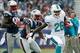 Oct 27, 2013; Foxborough, MA, USA; New England Patriots cornerback Alfonzo Dennard (37) forces Miami Dolphins running back Lamar Miller (26) out of bounds during the first quarter at Gillette Stadium. Mandatory Credit: Stew Milne-USA TODAY Sports