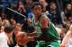 MINNEAPOLIS, MN - NOVEMBER 16: MarShon Brooks #12 of the Boston Celtics passes the ball against the Minnesota Timberwolves November 16, 2013 at Target Center in Minneapolis, Minnesota. NOTE TO USER: User expressly acknowledges and agrees that, by downlo