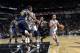 SAN ANTONIO, TX - January 15: Tony Parker #9 of the San Antonio Spurs drives to the basket against the Utah Jazz at the AT&T Center on January 15, 2014 in San Antonio, Texas. NOTE TO USER: User expressly acknowledges and agrees that, by downloading and or
