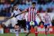 MADRID, SPAIN - JANUARY 14: Diego Costa (R) of Club Atletico de Madrid is chased by by Ricardo Costa of Valencia CF during the Copa del Rey Round of 16, 2nd leg match between Club Atletico de Madrid and Valencia CF at Vicente Calderon Stadium on January