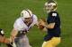SOUTH BEND, IN - OCTOBER 13: Tommy Rees #11 of the Notre Dame Fighting Irish looks for a receiver during overtime as Trent Murphy #93 of the Standford Cardinal applies pressure at Notre Dame Stadium on October 13, 2012 in South Bend, Indiana. Notre Dame d