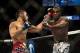 Jan 15, 2014; Duluth, GA, USA; Lorenz Larkin (red gloves) fights Brad Tavares (blue gloves) during UFC Fight Night at Gwinnett Center. Mandatory Credit: Joshua S. Kelly-USA TODAY Sports