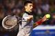 MELBOURNE, AUSTRALIA - JANUARY 17: Novak Djokovic of Serbia plays a forehand in his third round match against Denis Istomin of Uzbekistan during day five of the 2014 Australian Open at Melbourne Park on January 17, 2014 in Melbourne, Australia. (Photo b