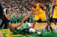 BOSTON, MA - FEBRUARY 9: Kobe Bryant #24 of the Los Angeles Lakers helps up Rajon Rondo #9 of the Boston Celtics on February 9, 2012 at the TD Garden in Boston, Massachusetts. NOTE TO USER: User expressly acknowledges and agrees that, by downloading and o