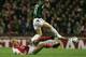 LONDON - NOVEMBER 2: Pascal Cygan of Arsenal battles for the ball with Dimitrios Papadopoulos of Panathinaikos during the UEFA Champions League Group E match between Arsenal and Panathinaikos at Highbury on November 2, 2004 in London. (Photo by Ben Radfo