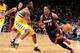 DENVER, CO - DECEMBER 30: Mario Chalmers #15 of the Miami Heat dribbles to the basket against the Denver Nuggets on December 30, 2013 at the Pepsi Center in Denver, Colorado. NOTE TO USER: User expressly acknowledges and agrees that, by downloading and/or