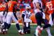 DENVER, CO - JANUARY 19: Tom Brady #12 of the New England Patriots gets up after being sacked on a fourth down in the fourth quarter by Terrance Knighton #94 of the Denver Broncos during the AFC Championship game at Sports Authority Field at Mile High on