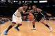 Jan. 21, 2013; New York, NY, USA; New York Knicks small forward Carmelo Anthony (7) drives the ball around Brooklyn Nets shooting guard Joe Johnson (7) during the second half at Madison Square Garden. Nets won 88-85. Mandatory Credit: Debby Wong-USA TODAY
