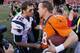 DENVER, CO - JANUARY 19: Tom Brady #12 of the New England Patriots congratulates Peyton Manning #18 of the Denver Broncos after the Broncos defeated the Patriots 26 to 16 during the AFC Championship game at Sports Authority Field at Mile High on January