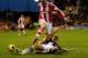 STOKE ON TRENT, ENGLAND - JANUARY 12: Geoff Cameron of Stoke City is tackled by Steven Gerrard of Liverpool during the Barclays Premier League match between Stoke City and Liverpool at Britannia Stadium on January 12, 2014 in Stoke on Trent, England. (P