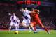 LIVERPOOL, ENGLAND - JANUARY 18: Luis Suarez of Liverpool challenges Ciaran Clark of Aston Villa during the Barclays Premier League match between Liverpool and Aston Villa at Anfield on January 18, 2014 in Liverpool, England. (Photo by Michael Regan/Get