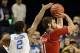Dec 28, 2013; Lexington, KY, USA; Kentucky Wildcats guard Aaron Harrison (2) pressures Louisville Cardinals forward Luke Hancock (11) as he shoots during the first half at Rupp Arena. Kentucky defeated Louisville 73-66. Mandatory Credit: Jamie Rhodes-USA
