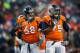 DENVER, CO - DECEMBER 8: The breath of Zane Beadles #68 and tackle Chris Clark #75 of the Denver Broncos is visible as the two wait for a time out to end during a game against the Tennessee Titans at Sports Authority Field Field at Mile High on December