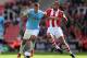 STOKE ON TRENT, ENGLAND - SEPTEMBER 14: Jack Rodwell of Manchester City is tackled by Steven Nzonzi of Stoke City during the Barclays Premier League match between Stoke City and Manchester City at Britannia Stadium on September 14, 2013 in Stoke on Trent