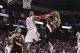 Jan 20, 2014; Houston, TX, USA; Houston Rockets center Dwight Howard (12) attempts to block a shot by Portland Trail Blazers point guard Damian Lillard (0) during the third quarter at Toyota Center. The Rockets defeated the Trailblazers 126-113. Mandatory