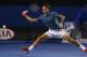 MELBOURNE, AUSTRALIA - JANUARY 20: Roger Federer of Switzerland stretches to play a forehand in his fourth round match against Jo-Wilfried Tsonga of France during day eight of the 2014 Australian Open at Melbourne Park on January 20, 2014 in Melbourne, A