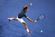 MELBOURNE, AUSTRALIA - JANUARY 20: Roger Federer of Switzerland plays a backhand in his fourth round match against Jo-Wilfried Tsonga of France during day eight of the 2014 Australian Open at Melbourne Park on January 20, 2014 in Melbourne, Australia. (