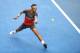 MELBOURNE, AUSTRALIA - JANUARY 20: Rafael Nadal of Spain plays a backhand in his fourth round match against Kei Nishikori of Japan during day eight of the 2014 Australian Open at Melbourne Park on January 20, 2014 in Melbourne, Australia. (Photo by Ryan