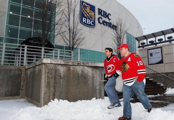 RALEIGH, NC - JANUARY 30: Hockey fans of the Carolina Hurricanes and the Chicago Blackhawks arrive at RBC Center early in spite of a rare ice and snow storm that hit the south on January 30, 2010 in Raleigh, North Carolina.  (Photo by Gregg Forwerck/NHLI 