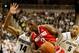EAST LANSING, MI - JANUARY 07: Shannon Scott #3 of the Ohio State Buckeyes looks to get around the defense of Gary Harris #14 of the Michigan State Spartans during the second half at the Jack T. Breslin Student Events Center on January 7, 2014 in East La