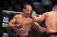 Dec 29, 2012; Las Vegas, NV, USA; Cain Velasquez (right) strikes Junior Dos Santos (left) during UFC 155 at the MGM Grand Garden Arena. Mandatory Credit: Gary A. Vasquez-USA TODAY Sports