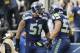 Dec 29, 2013; Seattle, WA, USA; Seattle Seahawks outside linebacker Malcolm Smith (53) celebrates with outside linebacker Bruce Irvin (51) after scoring a touchdown during the first half against the St. Louis Rams at CenturyLink Field. Mandatory Credit: S