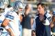 Aug 4, 2013; Canton, OH, USA; Dallas Cowboys quarterback Tony Romo (9) and receivers coach Derek Dooley during the 2013 Hall of Fame Game against the Miami Dolphins at Fawcett Stadium. Mandatory Credit: Kirby Lee-USA TODAY Sports