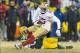 Jan 5, 2014; Green Bay, WI, USA; San Francisco 49ers wide receiver Michael Crabtree (15) is tackled by Green Bay Packers cornerback Jarrett Bush (24) after catching a pass during the fourth quarter of the 2013 NFC wild card playoff football game at Lambea