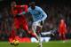 MANCHESTER, ENGLAND - DECEMBER 26: Yaya Toure of Manchester City is closed down by Glen Johnson of Liverpool during the Barclays Premier League match between Manchester City and Liverpool at Etihad Stadium on December 26, 2013 in Manchester, England. (P