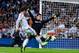 MADRID, SPAIN - SEPTEMBER 28: Alvaro Morata of Real Madrid CF shoots towards goal under a challenge by Thibaut Courtois of Atletico de Madrid during the La Liga match between Real Madrid CF and Club Atletico de Madrid at Bernabeu on September 28, 2013 in